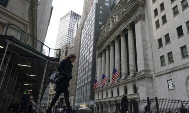 Pedestrians walk past the New York Stock Exchange on Thursday