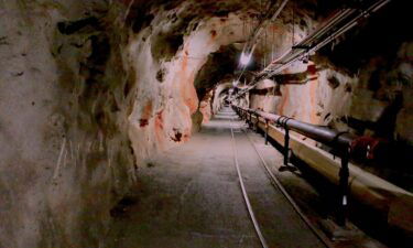 Overhead lights illuminate a tunnel inside the Red Hill Underground Fuel Storage Facility in Pearl Harbor