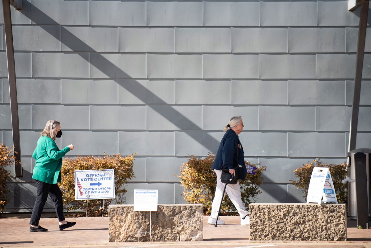<i>Emil Lippe/AP</i><br/>Voters walk into Lochwood Branch Library to participate in the Texas primary election in Dallas on Tuesday