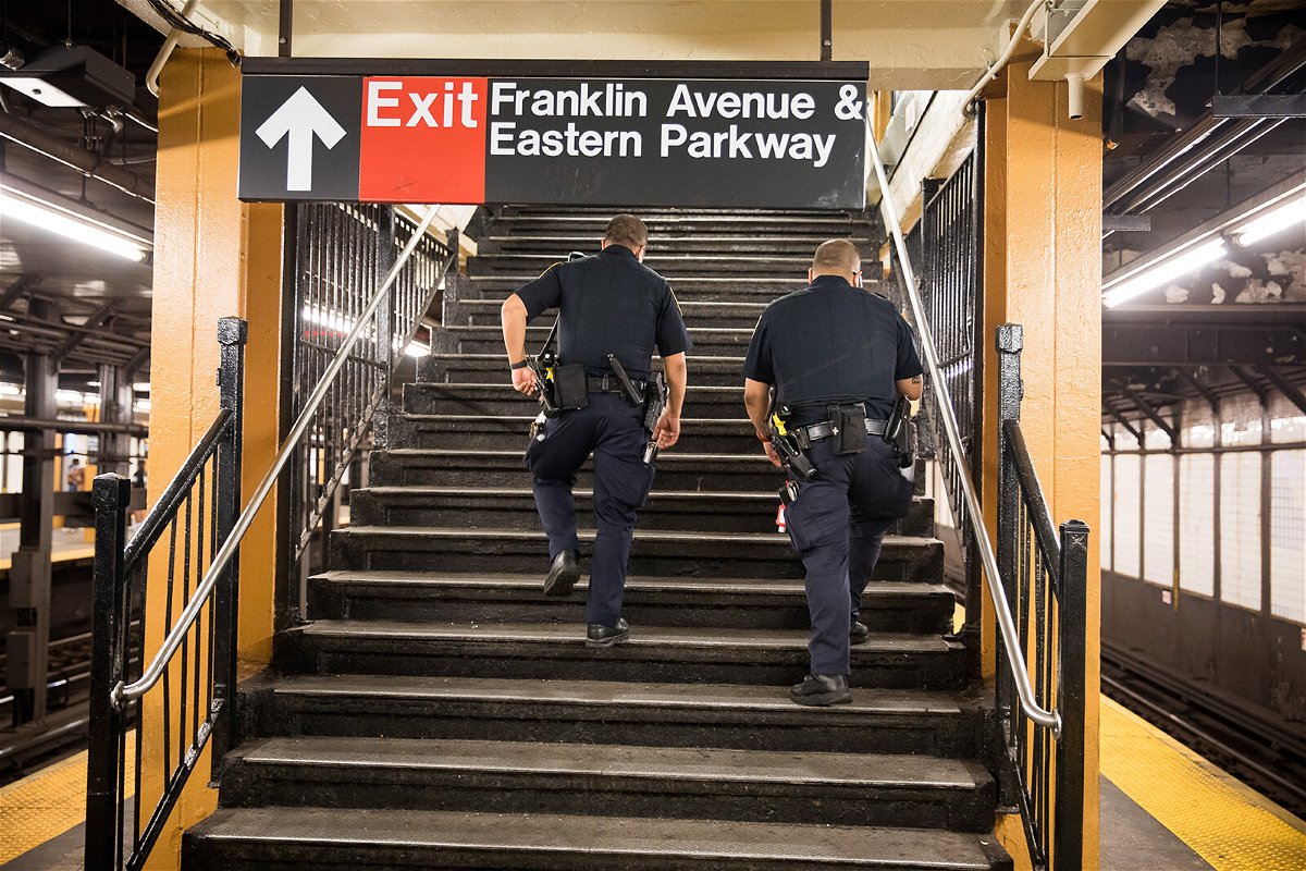 <i>Michael Nagle/Bloomberg/Getty Images</i><br/>NYPD officers patrol the Franklin Avenue subway station last July in New York