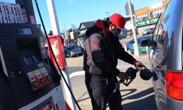 A Lukoil gas station attendant pumps gas in a customer's car on March 4 in the Canarsie neighborhood of Brooklyn in New York City.
