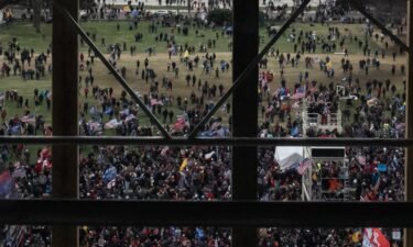A crowd of Trump supporters gather outside as seen from inside the US Capitol on January 6