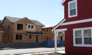 A home under construction stands across from a completed home at a housing development on March 23 in Petaluma