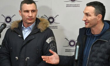 Kyiv mayor Vitali Klitschko (L) and his brother and former Ukrainian boxer Wladimir Klitschko (R) speak at a recruitment center in Kyiv in early February.