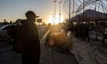 A migrant from Haiti near the San Ysidro Port of Entry border crossing bridge in Tijuana