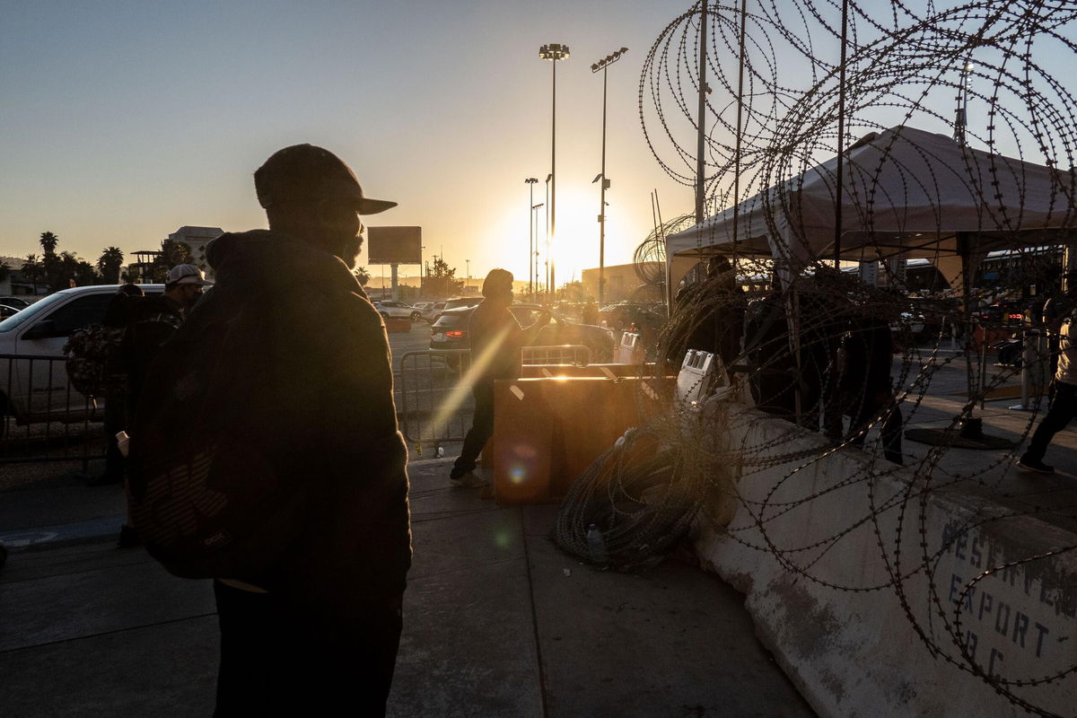 <i>Cesar Rodriguez/Bloomberg/Getty Images</i><br/>A migrant from Haiti near the San Ysidro Port of Entry border crossing bridge in Tijuana