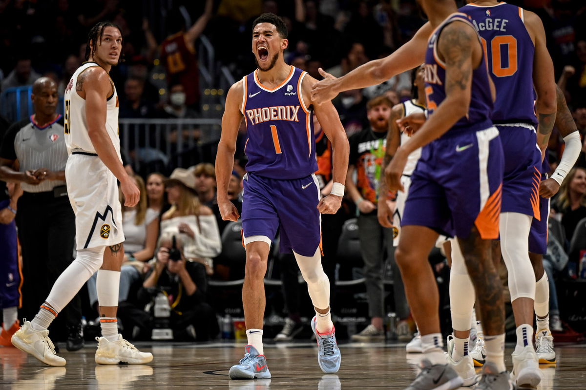 <i>AAron Ontiveroz/MediaNews Group//Denver Post/Getty Images</i><br/>Devin Booker lets out a primal roar after he grabbed an offensive rebound for a putback