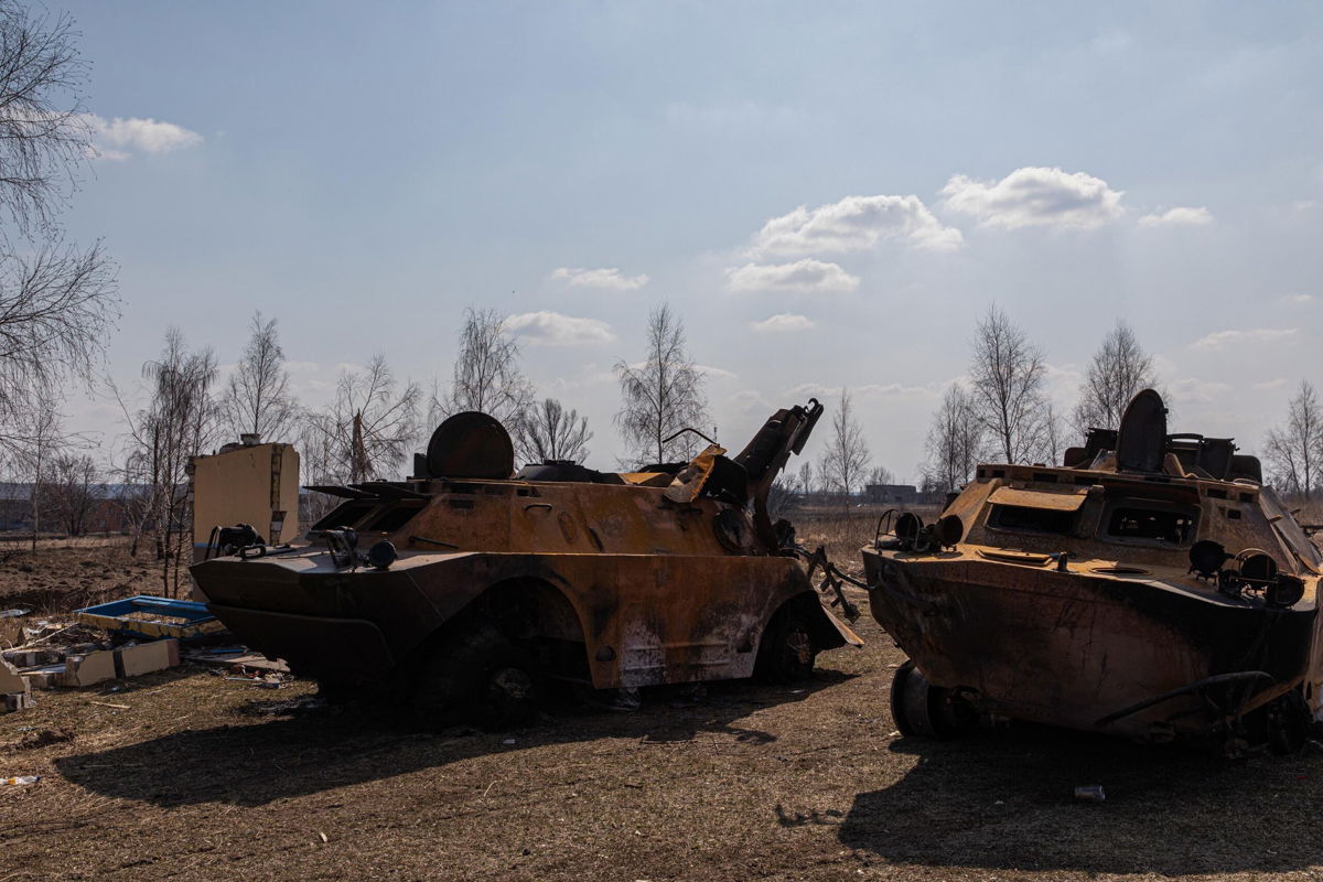 <i>Alex Chan Tsz Yuk/SOPA Images/LightRocket/Getty Images</i><br/>Two destroyed Russian armored personnel carriers are seen on March 25 in Kyiv.