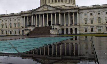 The US Capitol dome and its reflection are seen on Capitol Hill in Washington