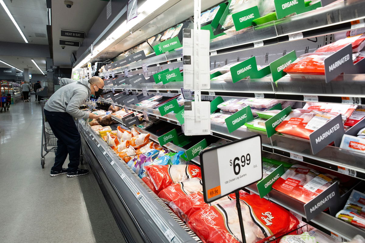 <i>Michael Reynolds/EPA-EFE/Shutterstock</i><br/>The pandemic and the supply chain crisis are causing consumer prices to increase at a level not seen since the start of 1982. Pictured here is a customer at a grocery store in Arlington