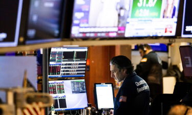 Traders work on the floor of the New York Stock Exchange as world markets continue to react to Russia's invasion of Ukraine