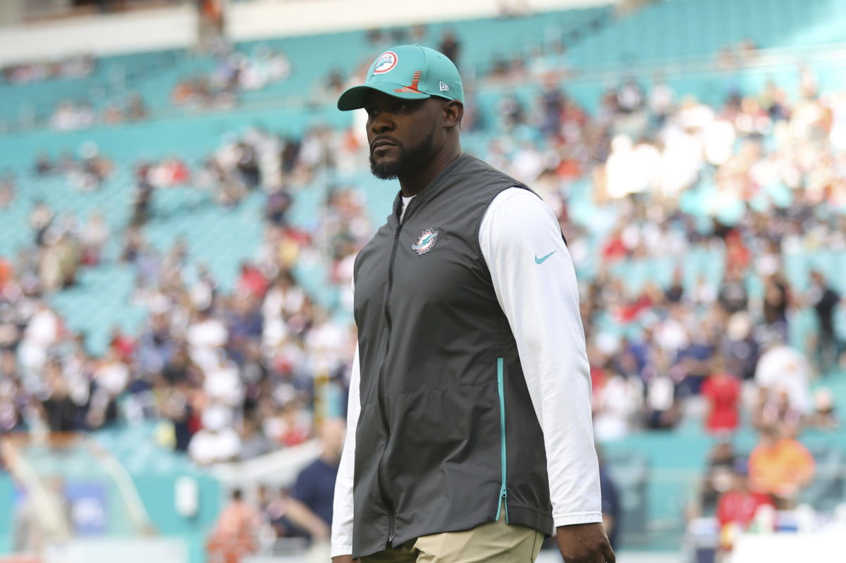 <i>Perry Knotts/AP</i><br/>Miami Dolphins head coach Brian Flores stands on the field prior to an NFL football game against the New England Patriots on January 9