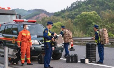 Rescuers head to the site of a plane crash on March 21 in China's Tengxian County.