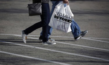 A customer carries a Bed Bath & Beyond Inc. shopping bag outside a store in Clarksville