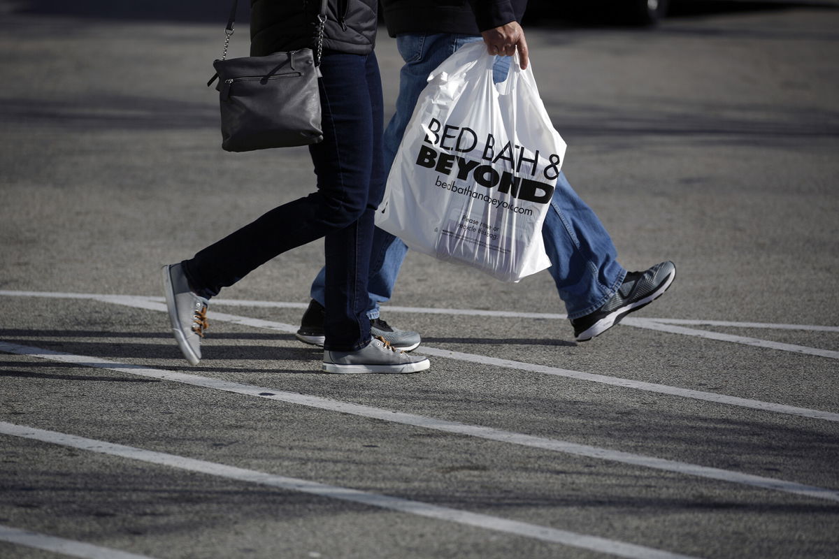 <i>Luke Sharrett/Bloomberg/Getty Images</i><br/>A customer carries a Bed Bath & Beyond Inc. shopping bag outside a store in Clarksville