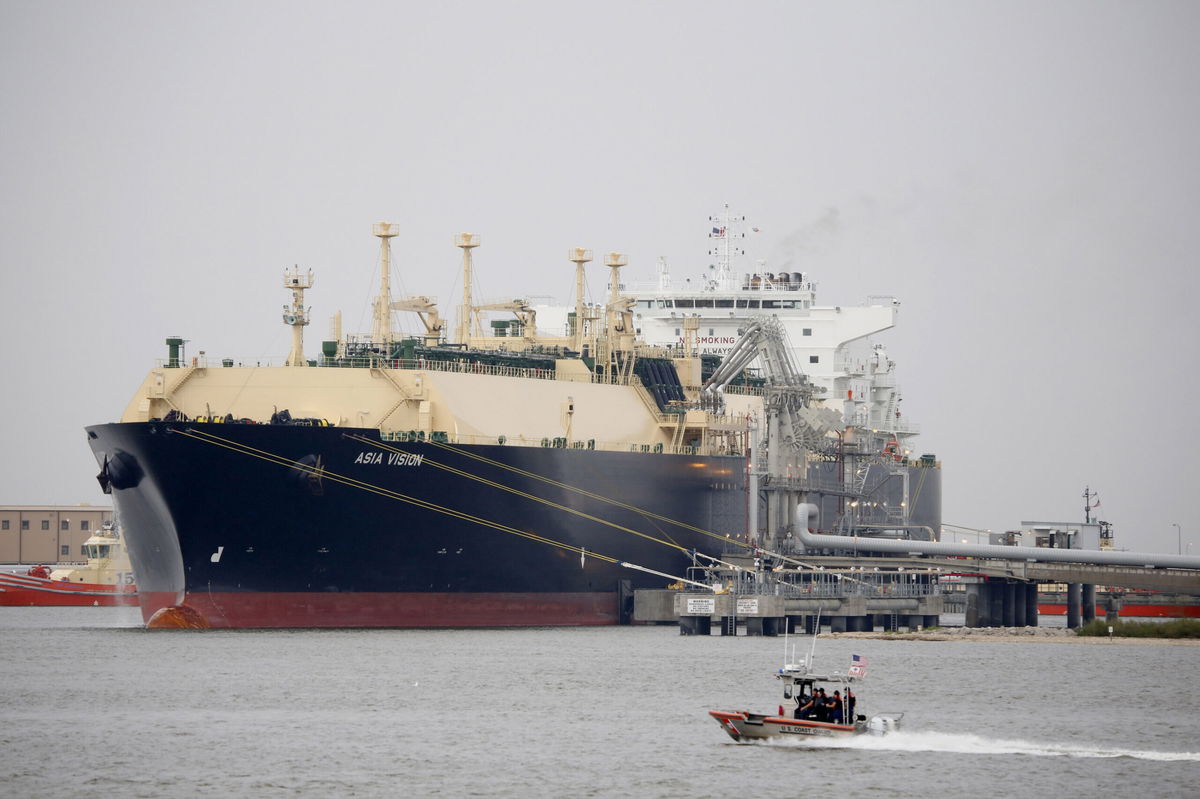 <i>Eric Kayne/Bloomberg/Getty Images</i><br/>A US Coast Guard boat moves past the Asia Vision LNG carrier ship docked at a terminal in Sabine Pass