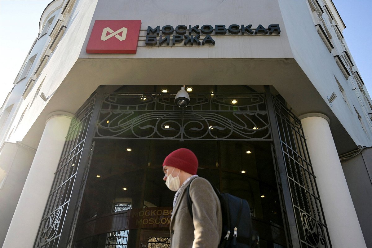 <i>Natalia Kolesnikova/AFP/Getty Images</i><br/>Pictured is a man walking past Moscow's stock market building on February 28. Several major US index providers have removed Russian stocks from indexes at a price of 