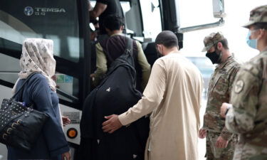 The Biden administration extends immigration relief to Afghans in the US. Afghan refugees here board a bus at Dulles International Airport on August 31