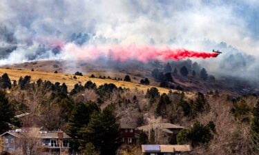 An air tanker drops slurry