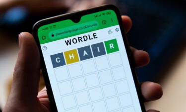A man plays with the word game Wordle seen in a close up on a mobile phone screen on the official app website in Barcelona