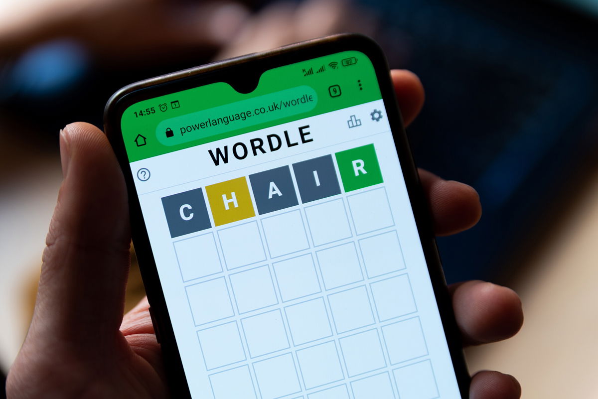 <i>Adobe Stock</i><br/>A man plays with the word game Wordle seen in a close up on a mobile phone screen on the official app website in Barcelona