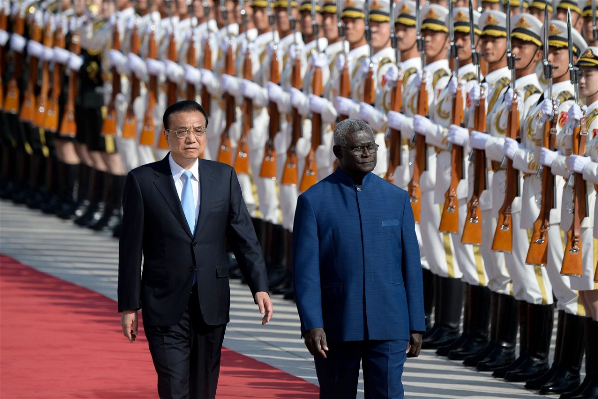 <i>WANG ZHAO/AFP/Getty Images</i><br/>Solomon Islands Prime Minister Manasseh Sogavare and Chinese Premier Li Keqiang at the Great Hall of the People in Beijing on October 9
