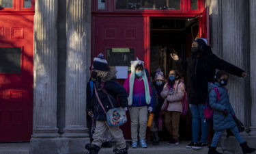 Student wear masks as they leave a Chicago elementary school on January 3.