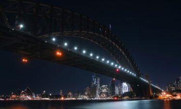 The Sydney Opera House and the Sydney Harbour Bridge are seen with their lights switched off during Earth Hour in Sydney