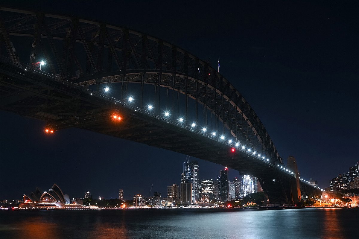 <i>Steven Saphore/AFP/Getty Images</i><br/>The Sydney Opera House and the Sydney Harbour Bridge are seen with their lights switched off during Earth Hour in Sydney