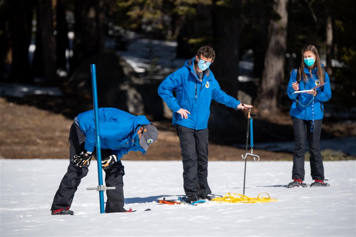 <i>Florence Low/California Department of Water Resources</i><br/>The third snow survey of the 2022 season is conducted at Phillips Station in the Sierra Nevadas.