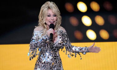 Host Dolly Parton speaks at the 57th Academy of Country Music Awards at Allegiant Stadium in Las Vegas.