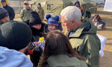 Former Vice President Mike Pence meets with refugees Thursday while visiting the Ukraine-Poland border.