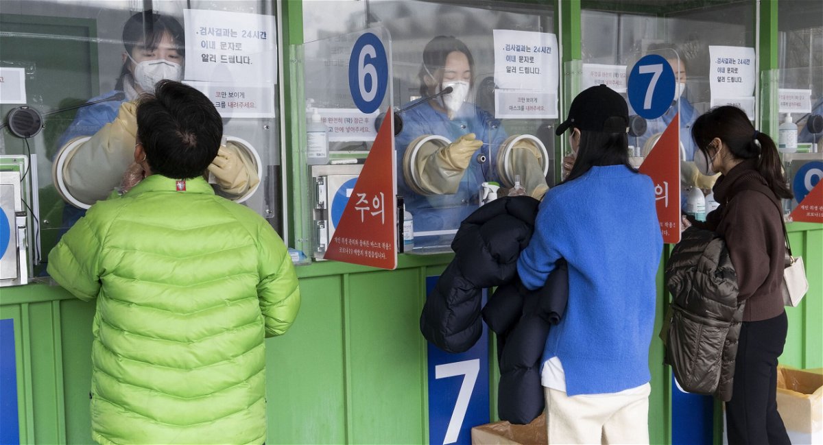 <i>Lee Young-ho/Sipa USA/AP</i><br/>People wait to receive Covid-19 tests in Seoul