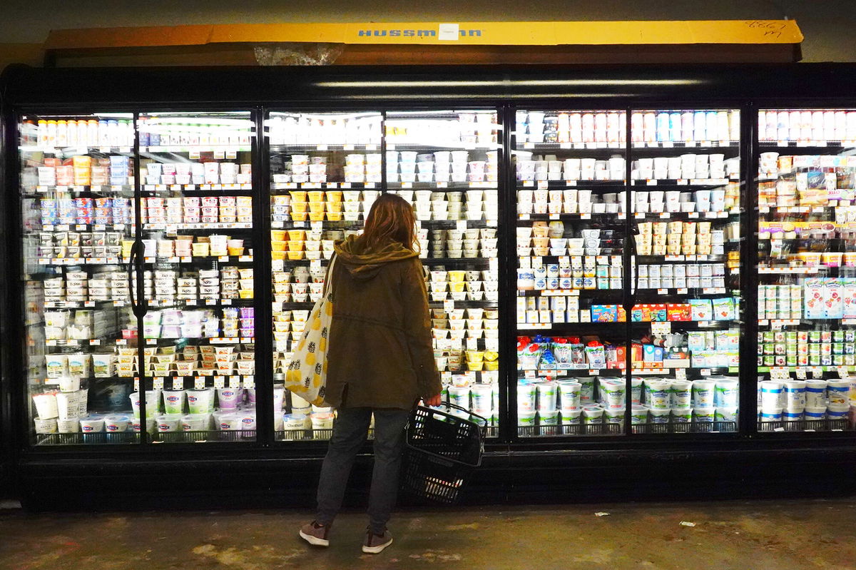 <i>Michael M. Santiago/Getty Images</i><br/>A person shops for groceries at Lincoln Market on March 10 in New York City. Consumer sentiment slumped again in March