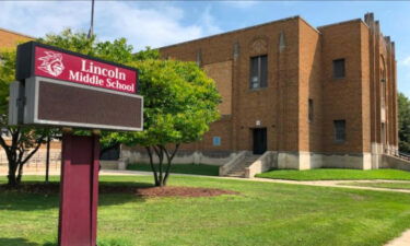 An off-duty officer put his knee on a 12-year-old's neck for more than 20 seconds while breaking up a school fight.