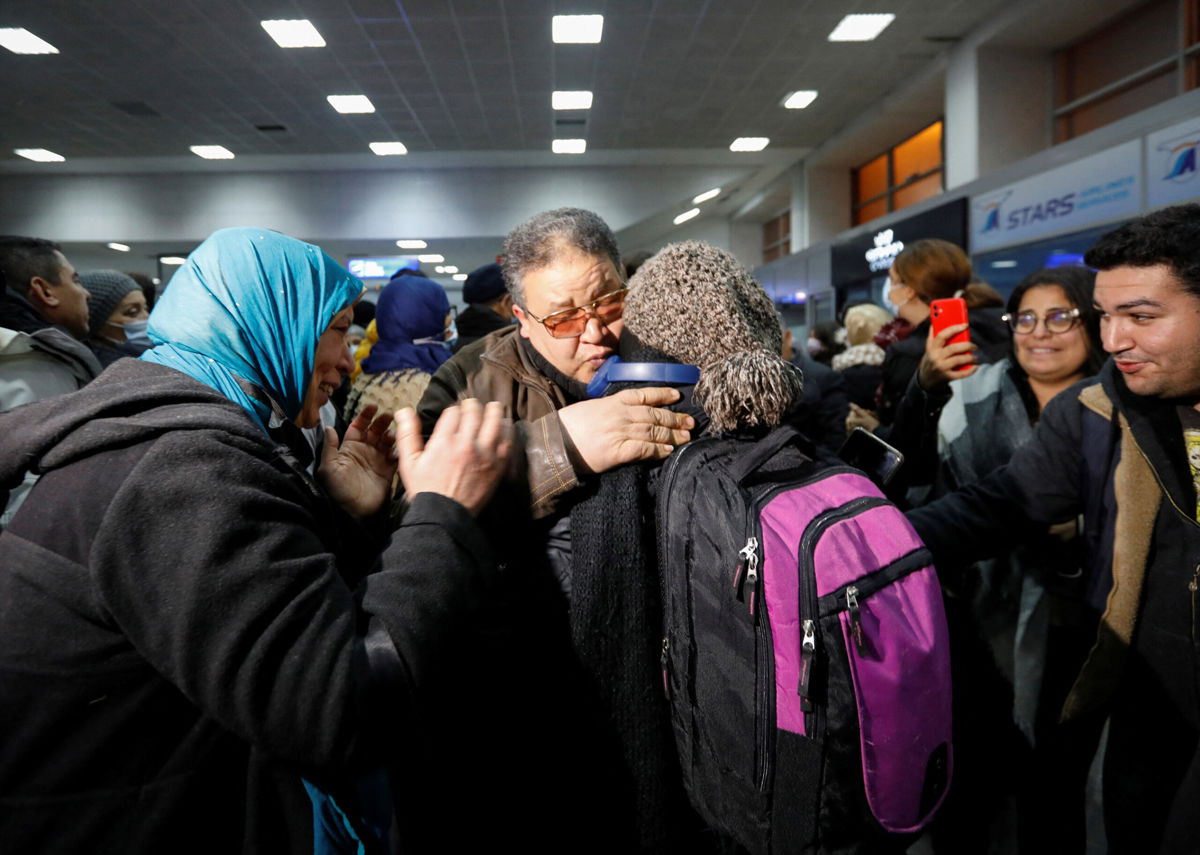 <i>ZOUBEIR SOUISSI/REUTERS</i><br/>Tunisians who fled to Romania following Russia's invasion of Ukraine were photographed on March 2 hugging their relatives in tears as they arrived at the airport in the Tunisian capital of Tunis.