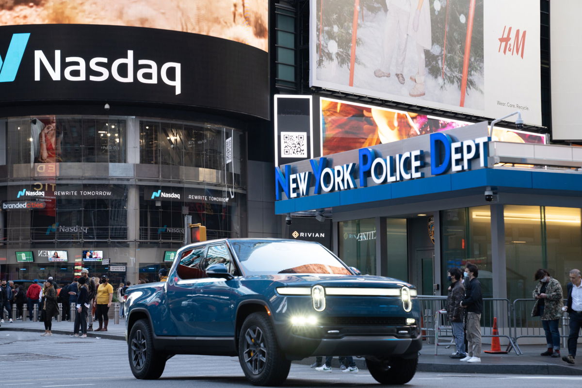 <i>Bing Guan/Bloomberg/Getty Images</i><br/>Rivian is rolling back price hikes on preordered vehicles following backlash from its customers. A Rivian R1T is seen here in Times Square