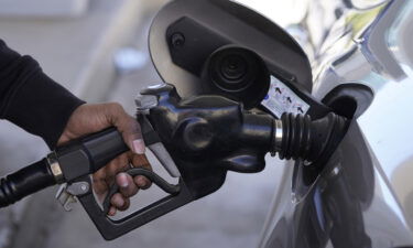 Why $4.01 gas in Mississippi hurts more than $5.72 gas in California? A motorist is seen pumping gasoline at a Mobil gas station following Russia's invasion of Ukraine.