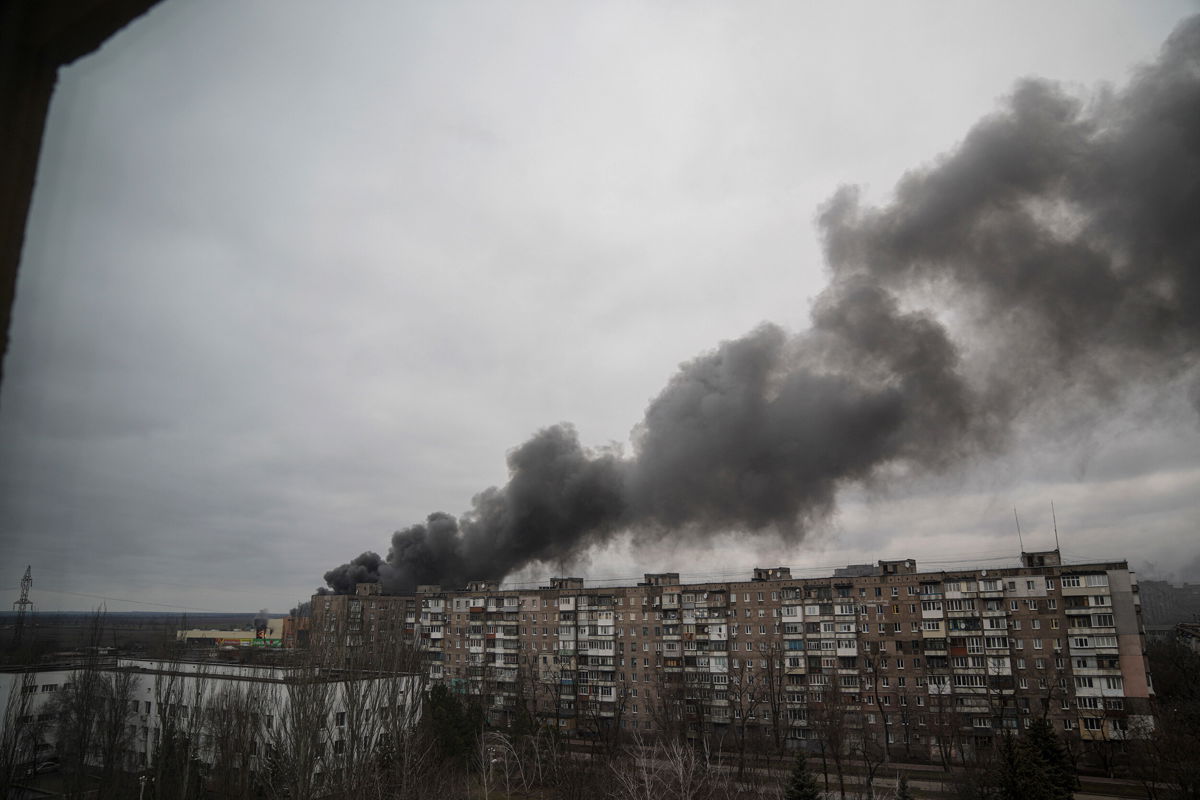 <i>Evgeniy Maloletka/AP</i><br/>Smoke rises after shelling by Russian forces in Mariupol