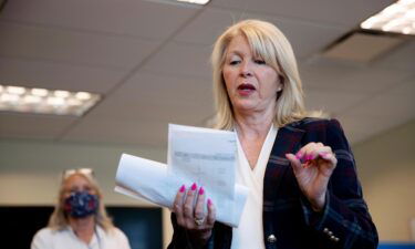 Mesa County Clerk Tina Peters reads an update on the election in Grand Junction