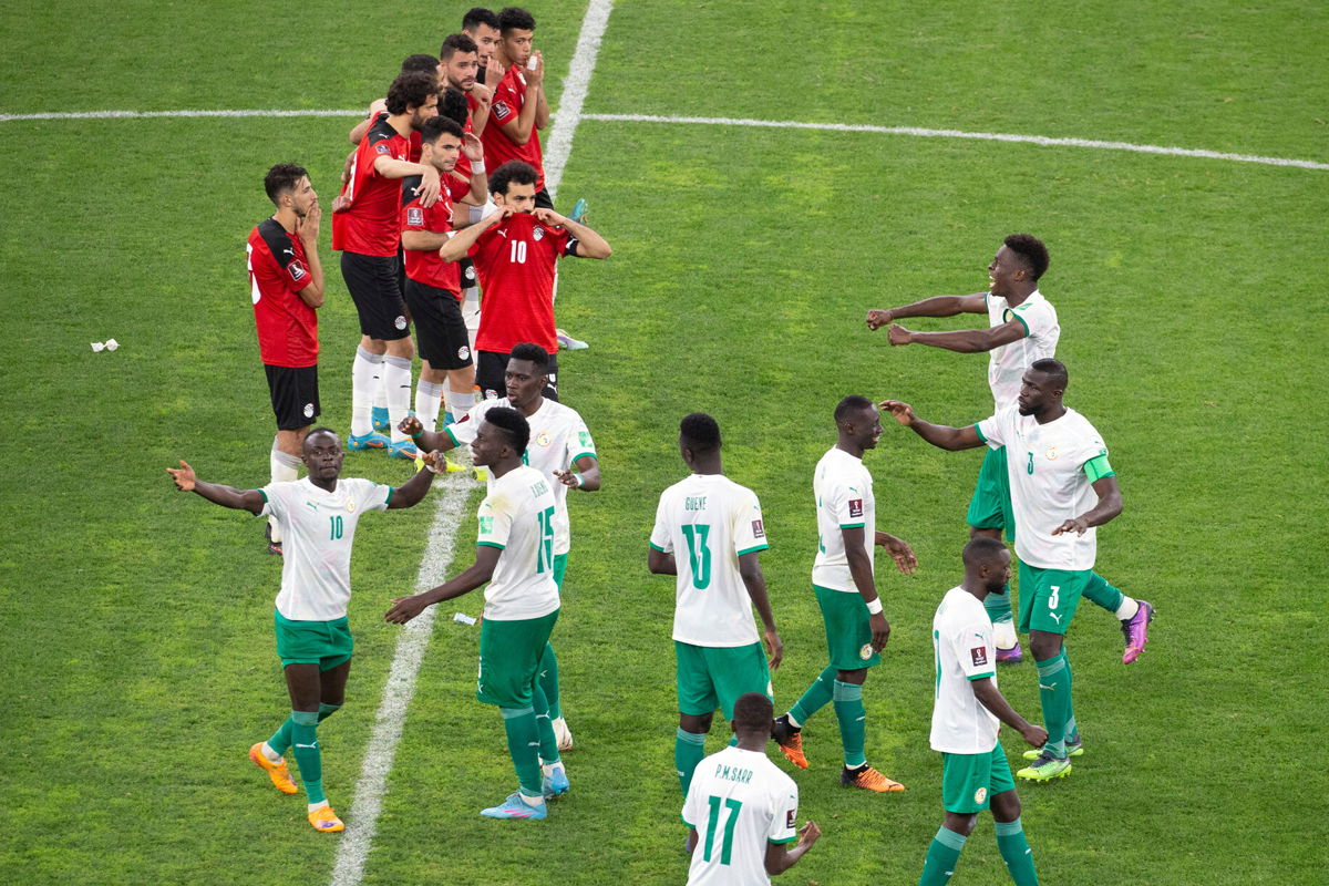 <i>Stefan Kleinowitz/AP</i><br/>Senegal's players celebrate during a penalty shootout against Egypt in Dakar