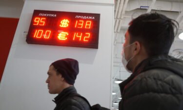 The currency exchange rates of the U.S. Dollar and Euro to the Russian Ruble are displayed outside a bank in Moscow