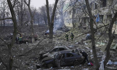 Ukrainian emergency employees work at a maternity hospital damaged by shelling in Mariupol