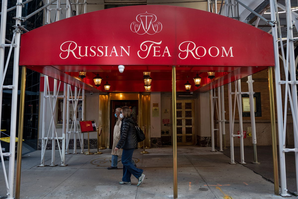 <i>Alexi Rosenfeld/Getty Images</i><br/>People wearing masks walk past the Russian Tea Room on October 17