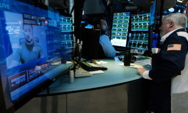 Traders work on the floor of the New York Stock Exchange as Ukrainian President Volodymyr Zelenskyy is shown addressing Congress on March 16. Stocks suggest that investors may be starting to tune out the war in Ukraine.