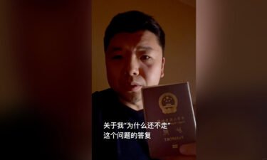 Wang Jixian holding his Chinese passport in a video posted to Douyin
