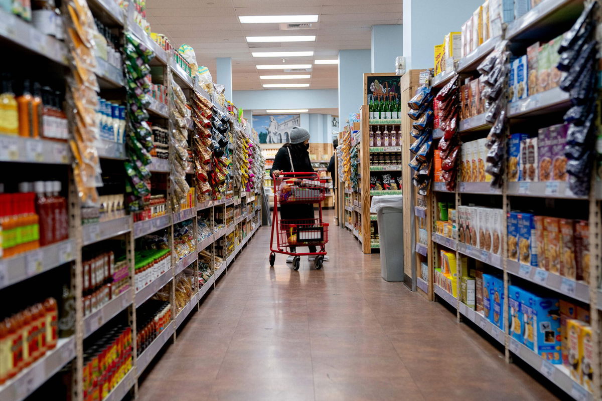 <i>STEFANI REYNOLDS/AFP/Getty Images</i><br/>A shopper walks through a grocery store in Washington