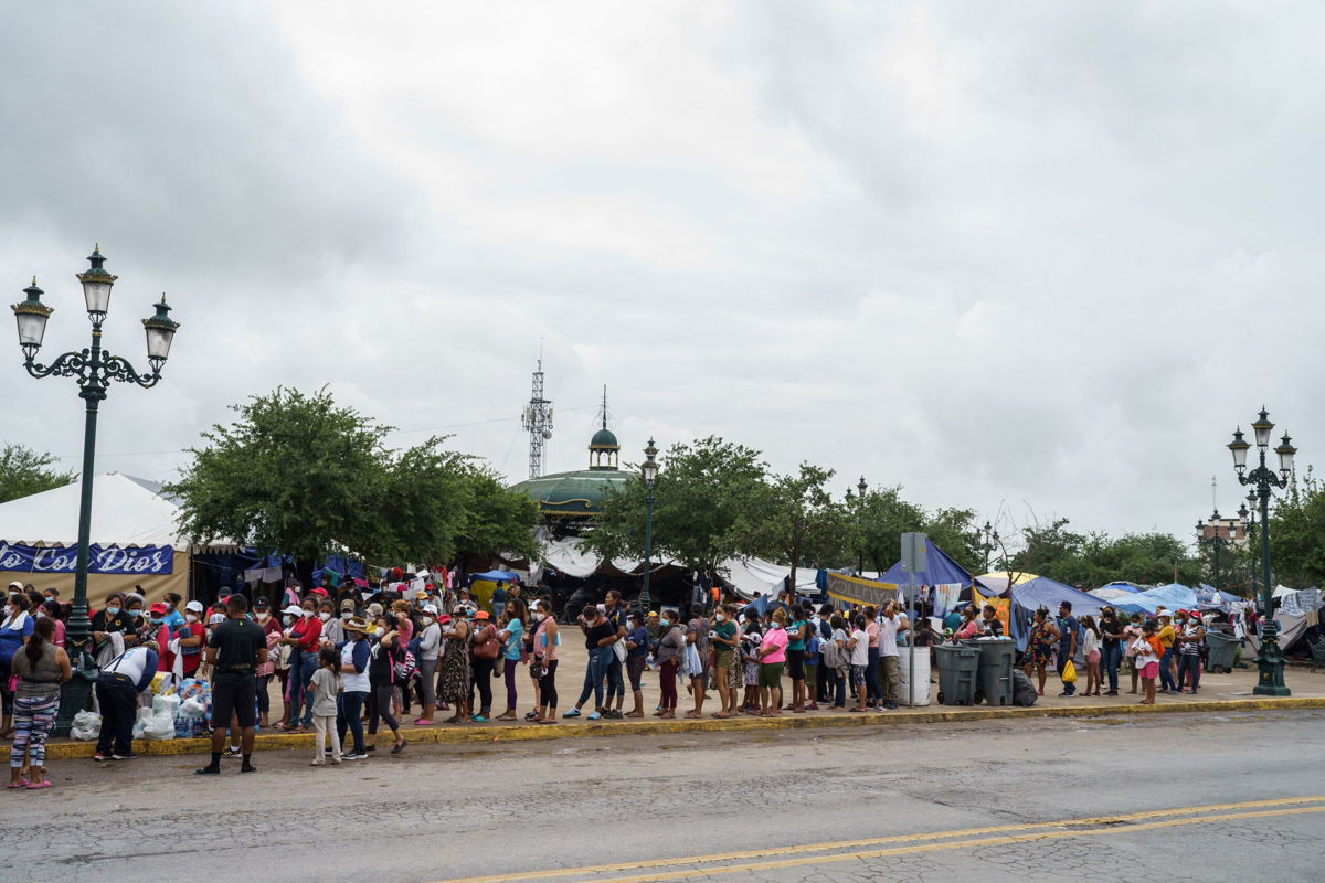 <i>Paul  Ratje/AFP/Getty Images</i><br/>A federal appeals court Friday gives narrow victory to the Biden administration on use of the Trump-era border policy. Migrants are seen here in a camp in Reynosa