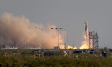 The New Shepard Blue Origin rocket lifts off from the launch pad carrying Jeff Bezos in Van Horn