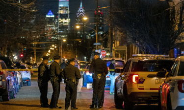 Police investigate the scene of the shooting on March 1